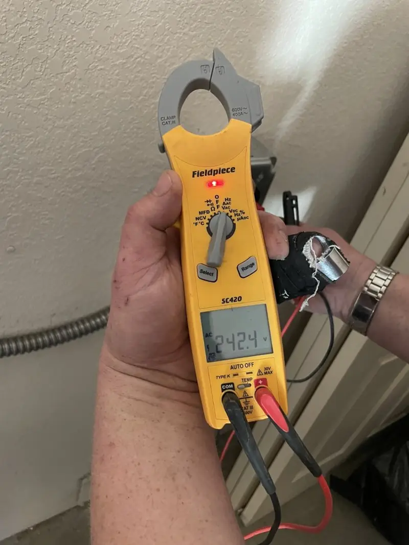 Voltage testing with clamp meter during Ceiling Fan Installation in Half Moon